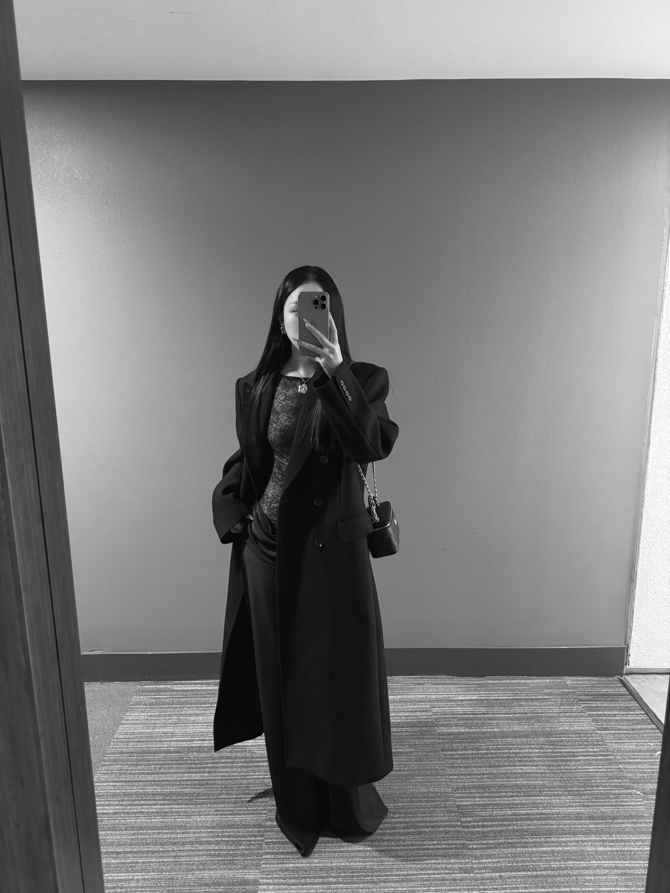 Fluid black dress in a pale gallery space
