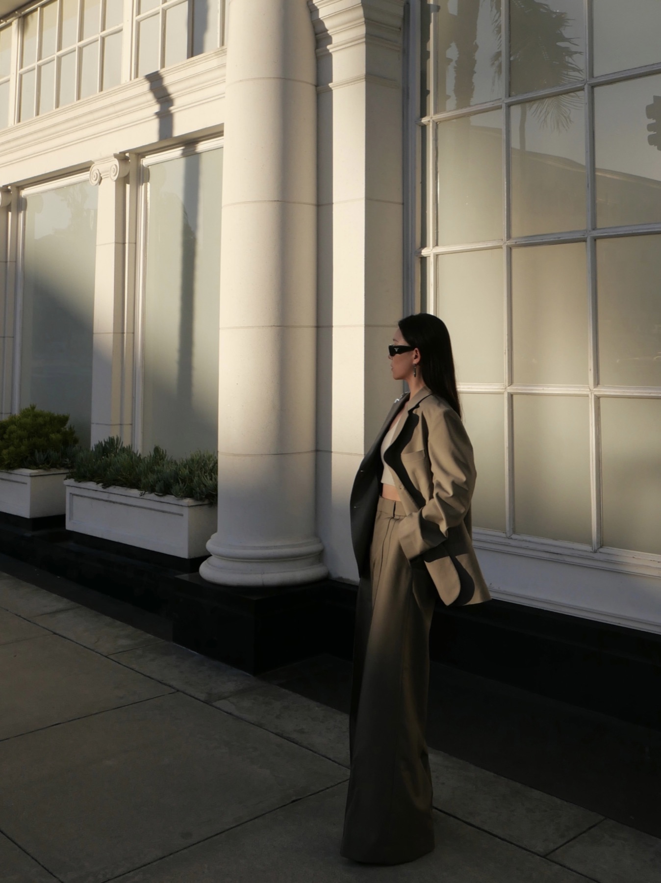 Neutral suit profile against classical columns