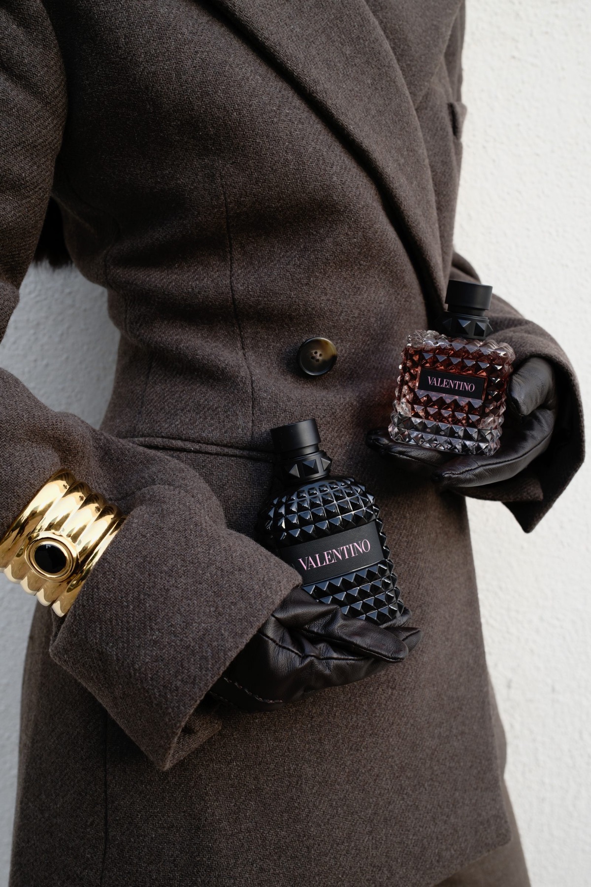 Fragrance styled with brown tailoring and jewellery